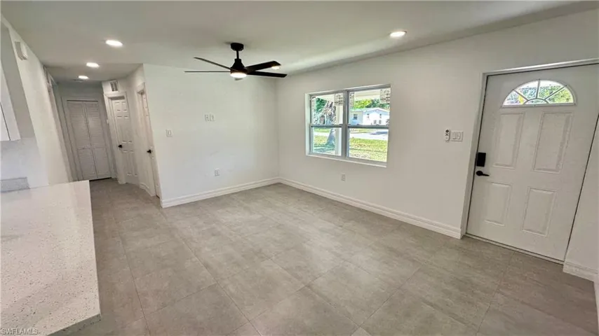 Foyer with baseboards, recessed lighting, and a ceiling fan
