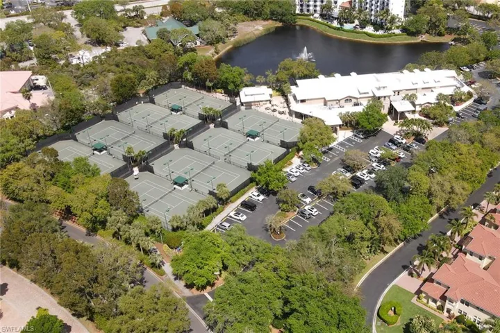 Aerial view of Pelican Bay clubhouse and one of several tennis facilities.