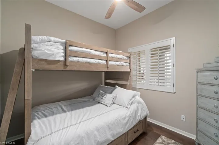 3rd bedroom with wood flooring and closet (now shown).