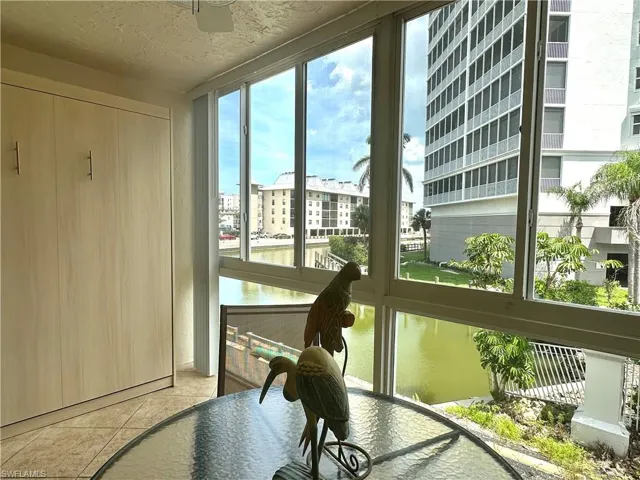 The newly up-fitted Hurricane impact glass two-tier sliding widows with screens provide storm protection and views of Water Turkey Bay and the Vanderbilt Lagoon.
