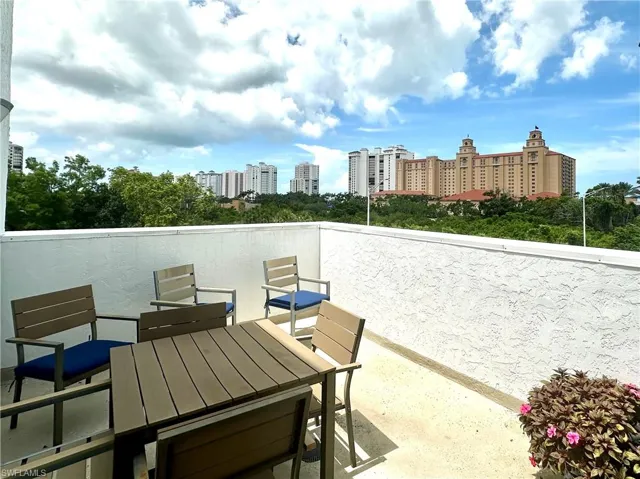 View of the Ritz-Carlton from patio / terrace featuring an outdoor lounging and dining area