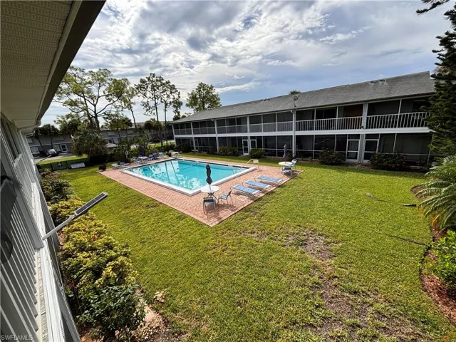 View of swimming pool featuring a lawn and a patio area