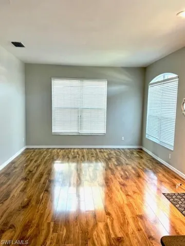 Empty room featuring hardwood / wood-style flooring