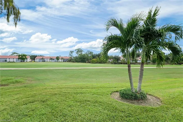 View of property's community featuring a lawn