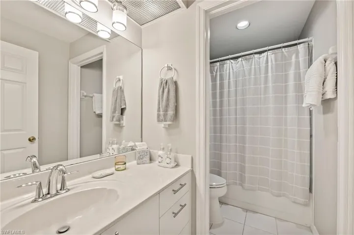 Guest bathroom vanity, shower and bath tub