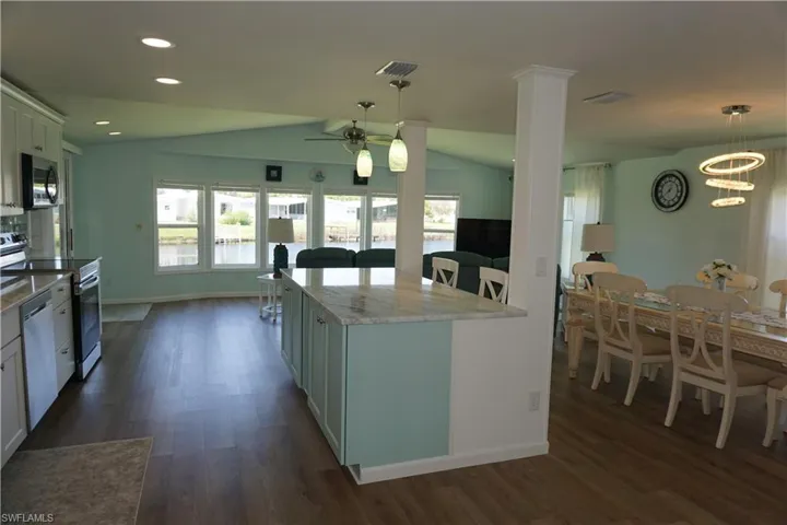 Open floor plan with kitchen/dining/family room