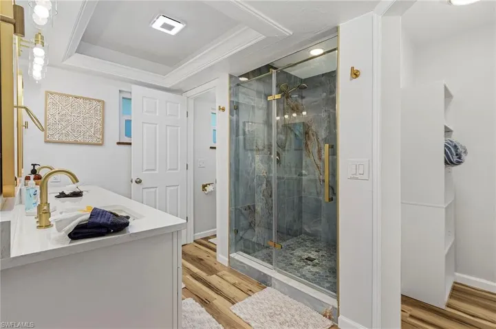 Amazing tile shower with dual sink and walk-in-closet.  The exhaust fan and light combo is Bluetooth enabled with a speaker to play music from your phone!  Yeah, that's pretty sweet.