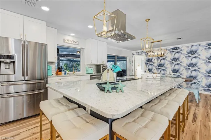The large quartz island provides plenty of extra seating for large get-togethers and on-the-go meals