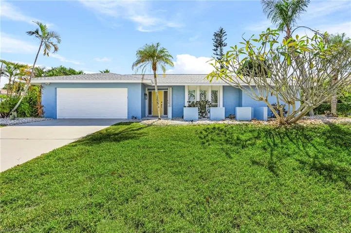 With a bunch of palms and a large plumeria that blooms white and yellow flowers, the property looks beautiful all year long!