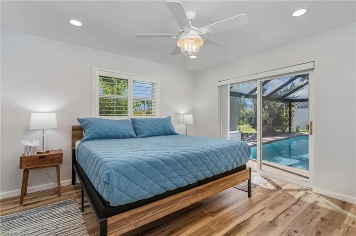 Guest bedroom with plenty of room for a king bed.  Sliders to the pool.
