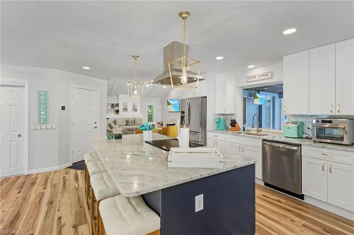 Kitchen open to the great room and living room.
