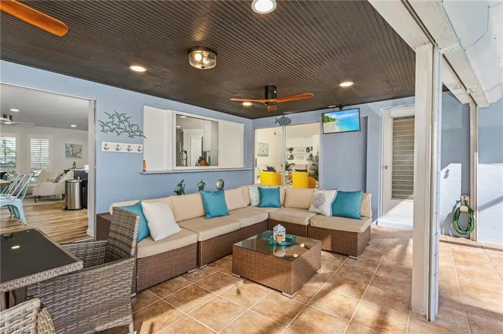 Plenty of space under the outdoor roof for both a lounge and an outdoor dining table or firepit.  There also is a pass through window for handing food and drinks from the kitchen to the patio.