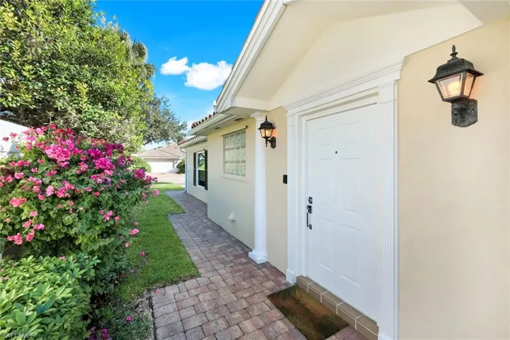 View of exterior entry featuring stucco siding