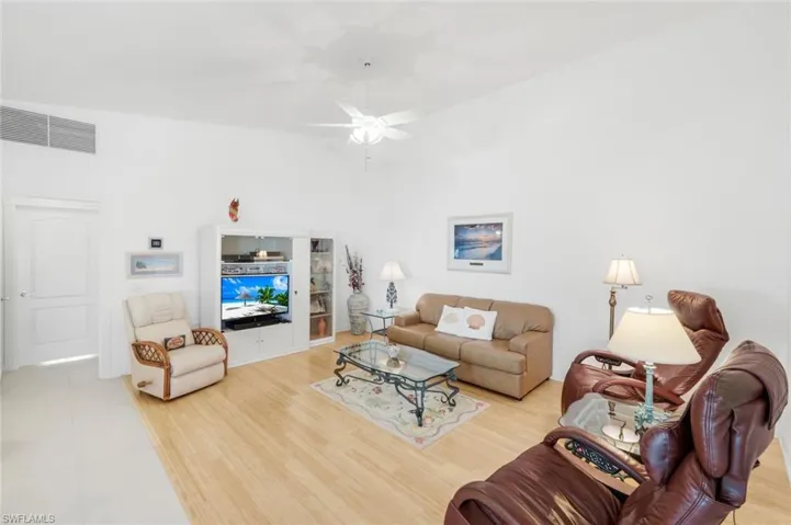 Spacious Living area featuring light wood-type flooring and a ceiling fan