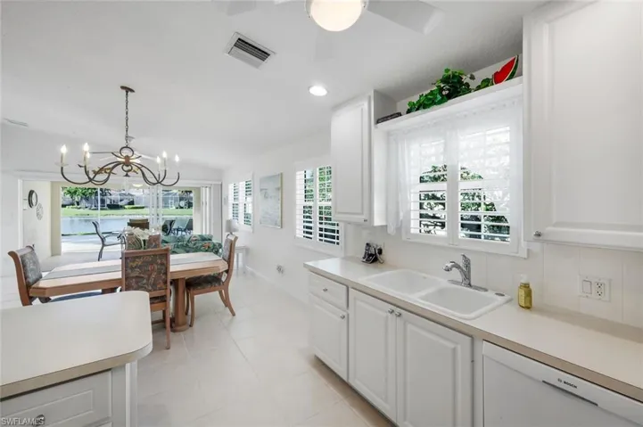 Kitchen featuring views to lanai and lake.