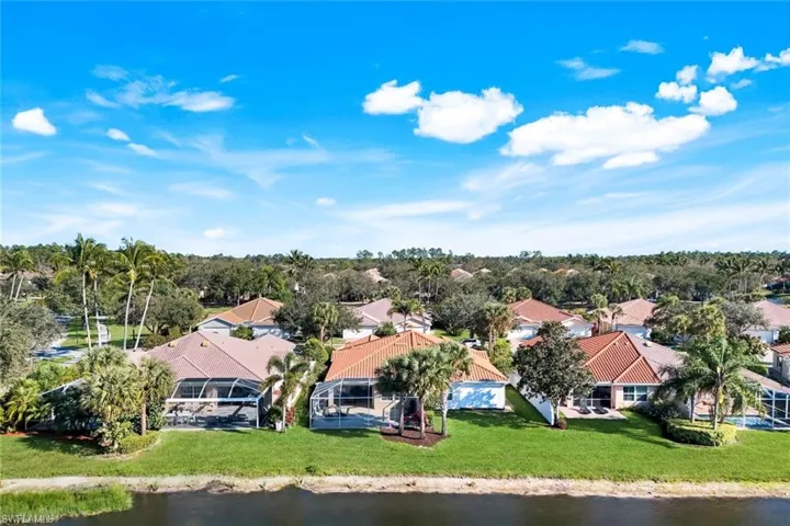 Aerial rear view of residential area featuring screened lanai.