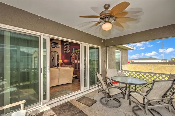 Sunroom featuring ceiling fan