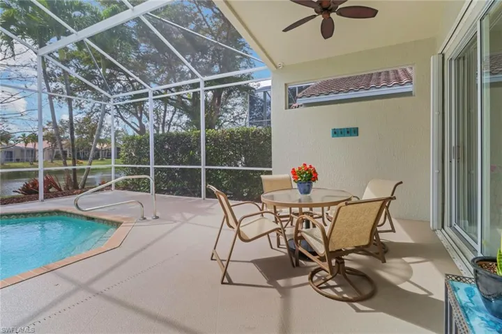 Pool featuring a lanai, a patio, and a ceiling fan