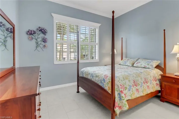 Bedroom with baseboards and crown molding