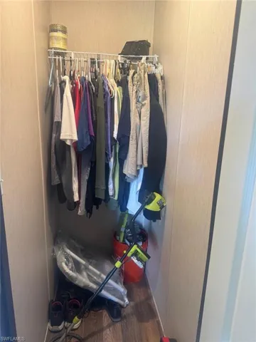 Spacious closet with wood finished floors