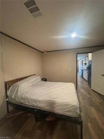 Bedroom featuring dark wood finished floors