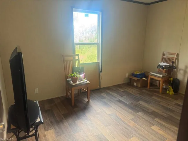 Miscellaneous room with wood finished floors