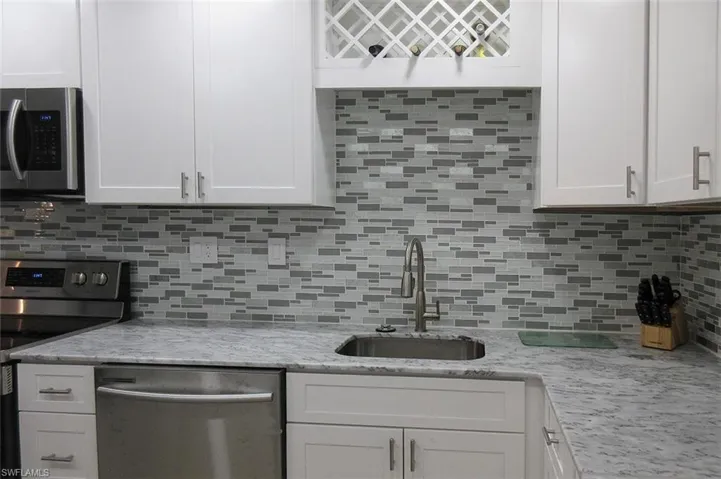 5 year old kitchen with new cabinets, counters, appliances, flooring, lighting, etc