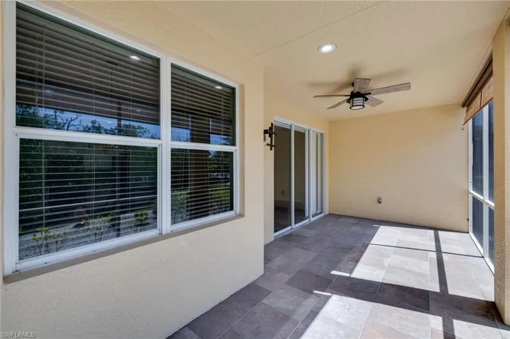 View of patio featuring a ceiling fan