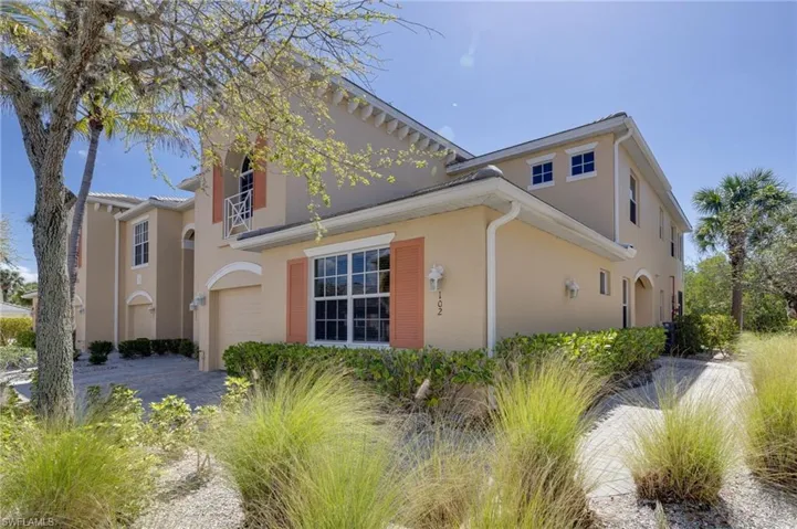 View of property exterior featuring stucco siding and an attached garage