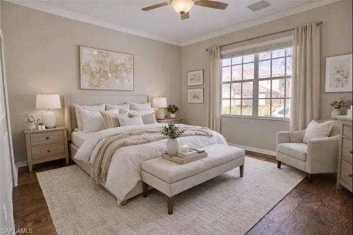 Virtually Staged Bedroom with ornamental molding, ceiling fan, and dark wood finished floors