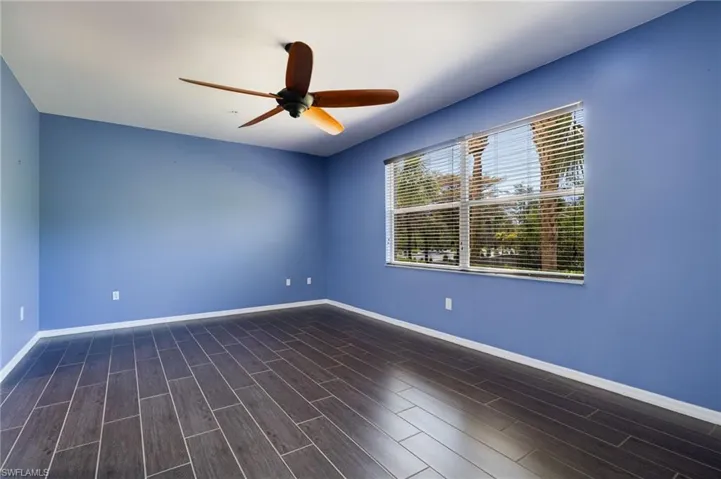 Unfurnished room with wood tiled floors and ceiling fan