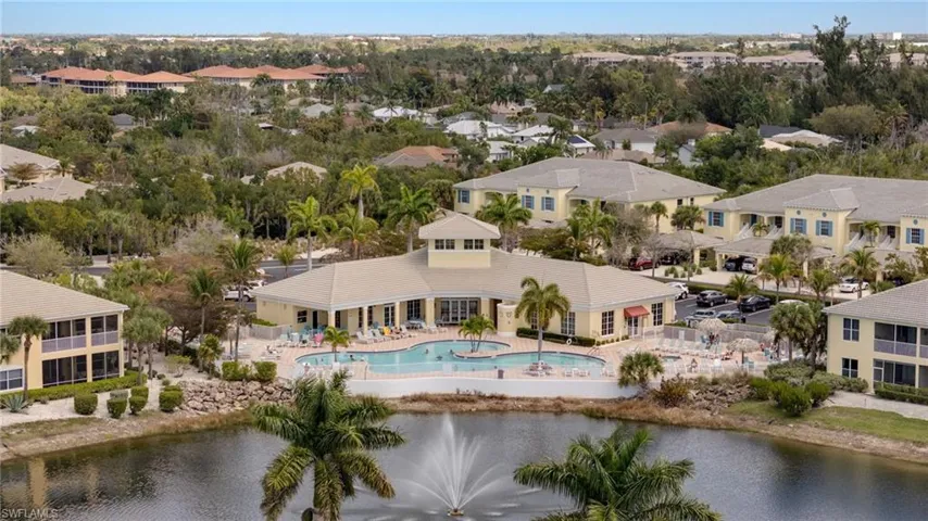 Aerial perspective of suburban area featuring a large body of water