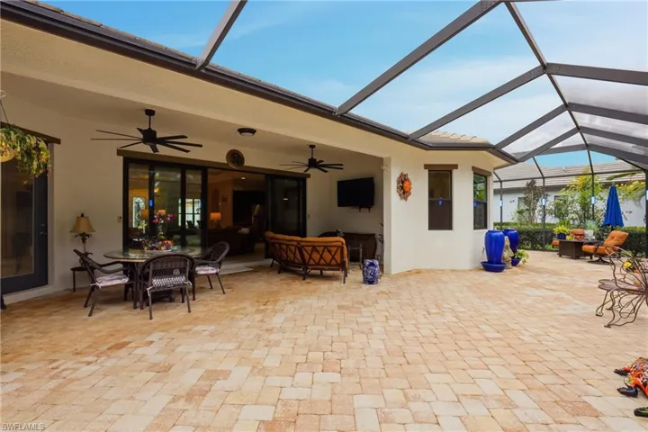 View of patio / terrace featuring a sunroom, outdoor lounge area, a lanai, and a ceiling fan