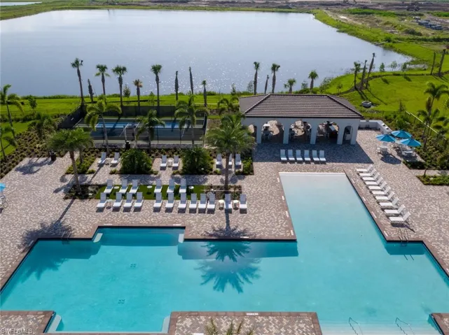 View of pool with a water view