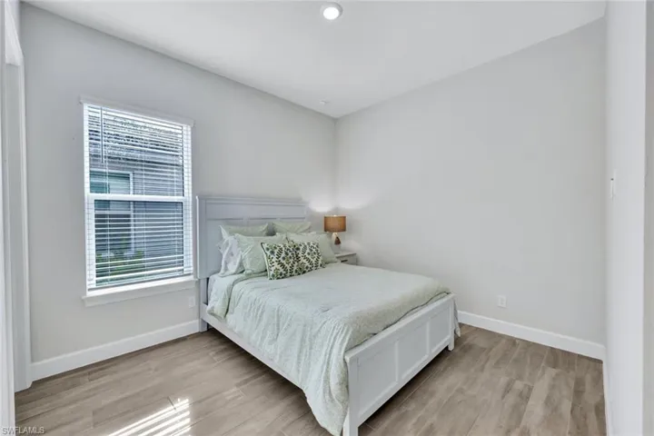 Bedroom with baseboards and light wood-style flooring