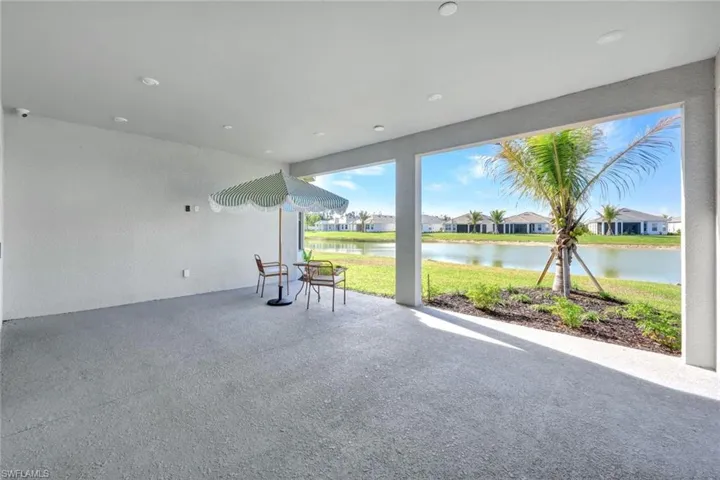 View of patio with a residential view and a water view