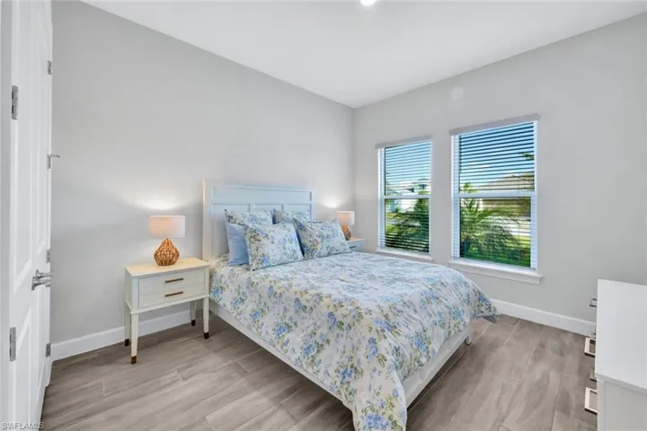 Bedroom with baseboards and light wood-style floors