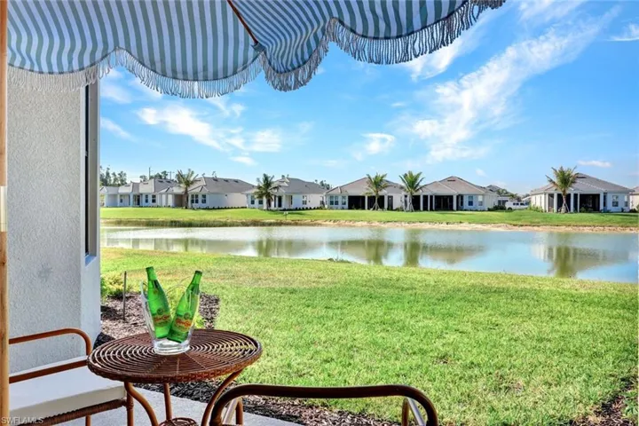 View of yard featuring a residential view and a water view