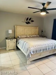 Bedroom featuring a ceiling fan and light tile patterned floors
