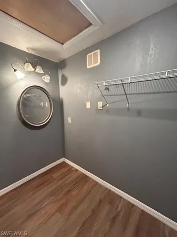 Washroom with hardwood / wood-style flooring