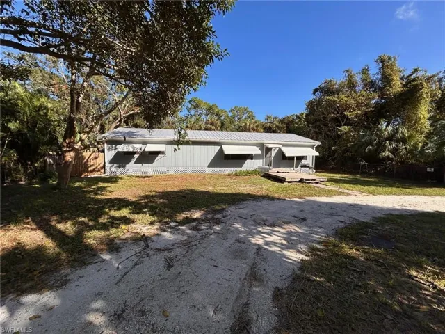 View of front of property with a front lawn