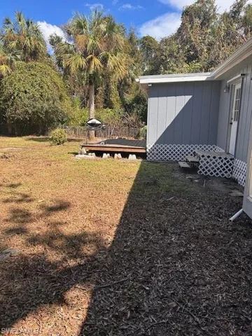 View of yard with a deck