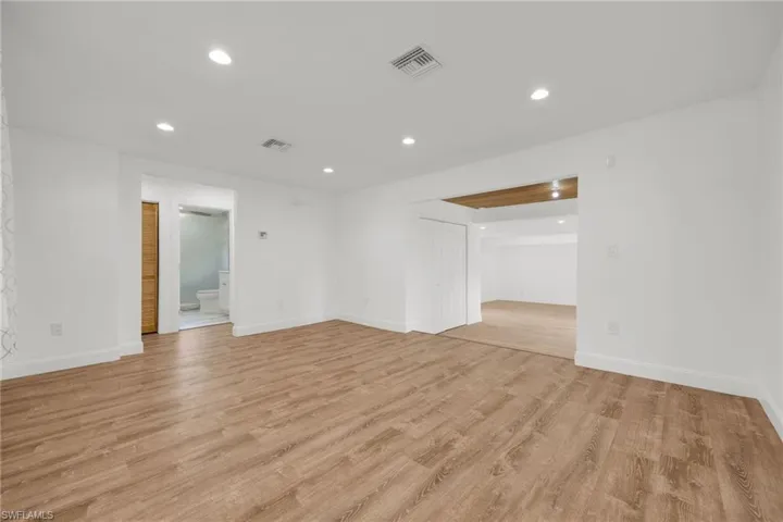 Unfurnished room with light hardwood / wood-style flooring