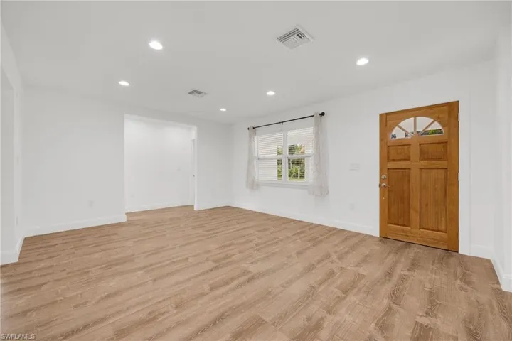 Entrance foyer featuring light wood-type flooring