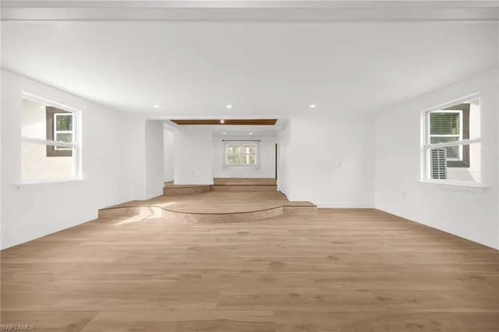 Unfurnished living room featuring light hardwood / wood-style flooring