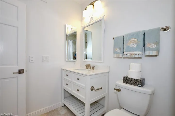 Full bathroom with vanity and toilet