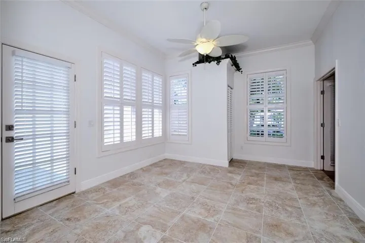 Office featuring ceiling fan and ornamental molding