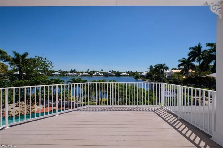 Wooden terrace featuring a water view