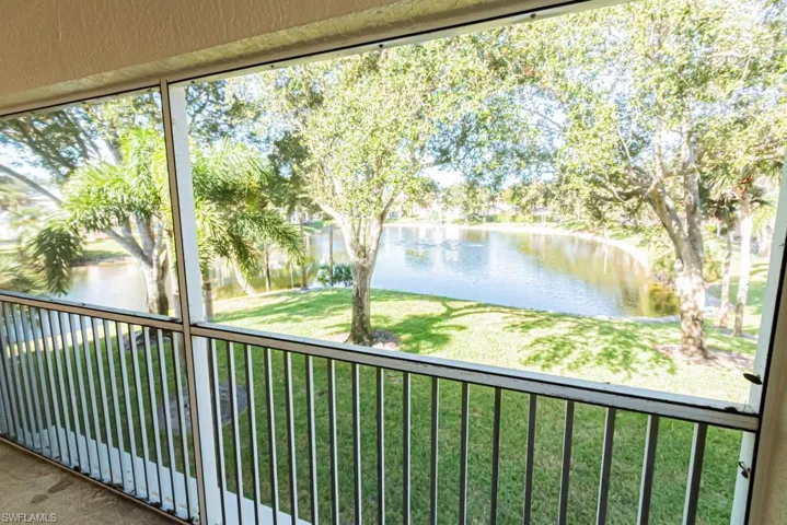 Balcony with a water view and a sunroom
