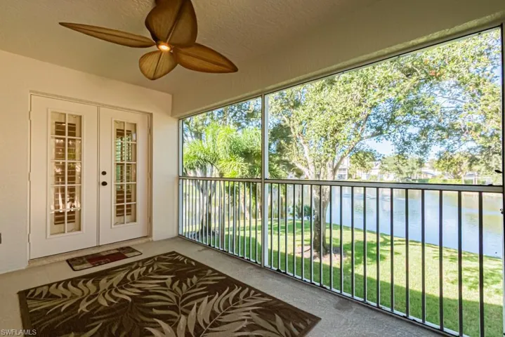 Unfurnished sunroom with a water view and french doors
